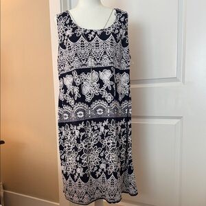 Black dress with white embroidered flowers size 18W with attached necklace.